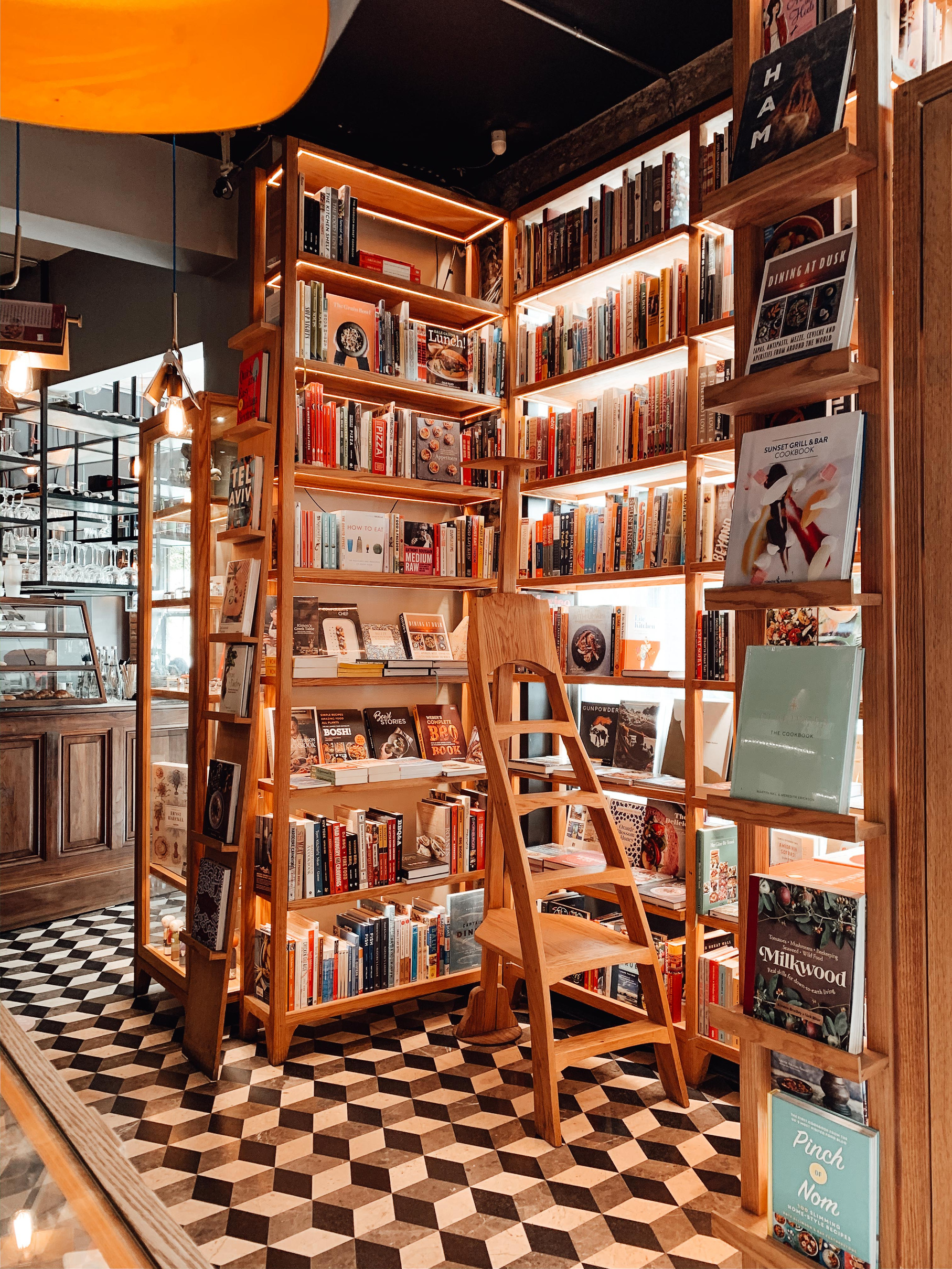 Classic wooden shelves with assorted books in store